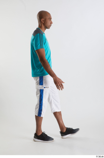 Tiago  1 black sneakers blue t shirt dressed side…